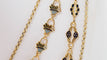 Collier Collier esclave en or jaune émaillé, pierres vertes et perles 58 Facettes 32174