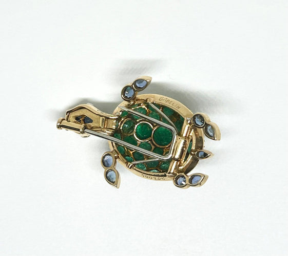 Broche Gübelin - Broche tortue en or jaune, émeraudes, saphirs et diamants 58 Facettes Gubelin