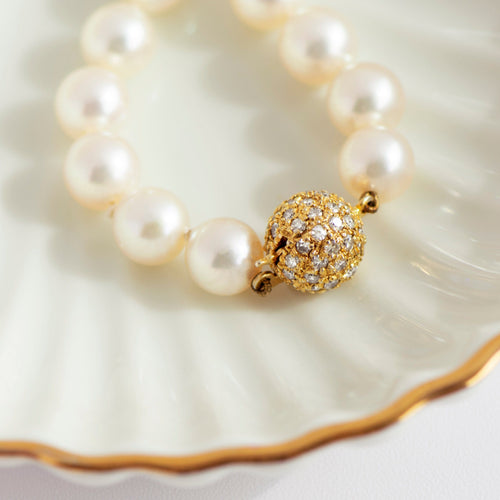 Collier Collier de perles de culture en or jaune 14 carats et diamants 58 Facettes HJ062613
