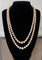 Collier Collier double rang Akoya en or jaune, grenats et diamants 58 Facettes 933