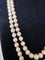Collier Collier double rang Akoya en or jaune, grenats et diamants 58 Facettes 933