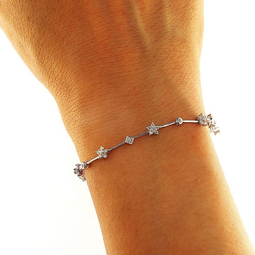 Bracelet Bracelet à segments et fleurs en or blanc et diamants 58 Facettes G3984