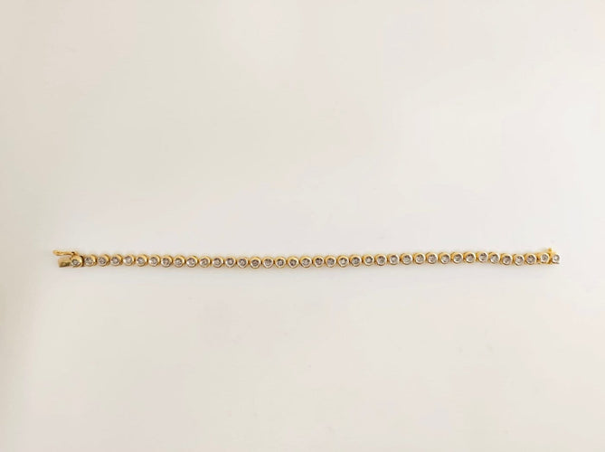 Bracelet rivière en or jaune 18K et diamants 58 Facettes LP1928/MMNNB