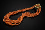 Collier Collier en corail avec fleur dorée 58 Facettes