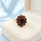 55 Bague marguerite en or jaune 18K et grenats 58 Facettes 1789