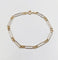 Bracelet vintage maille Figaro en or blanc et jaune 18k 58 Facettes A07559