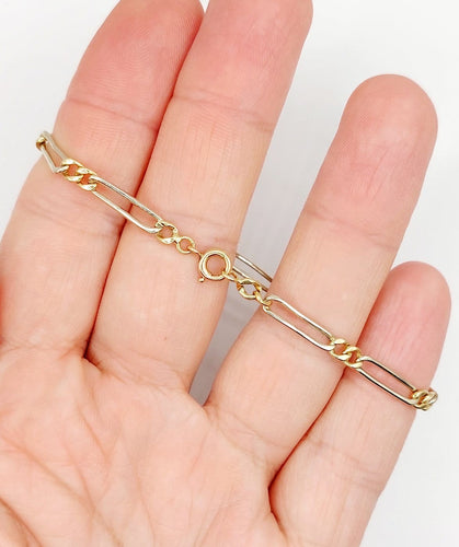 Bracelet vintage maille Figaro en or blanc et jaune 18k 58 Facettes A07559