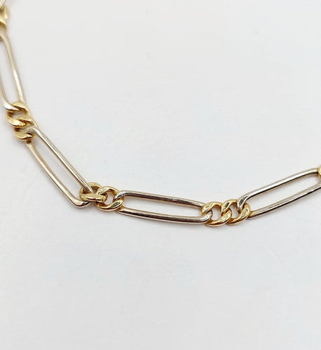 Bracelet vintage maille Figaro en or blanc et jaune 18k 58 Facettes A07559