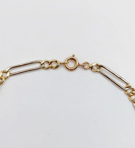 Bracelet vintage maille Figaro en or blanc et jaune 18k 58 Facettes A07559