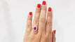 54 Bague entourage en or blanc, rubis et diamants 58 Facettes 32239