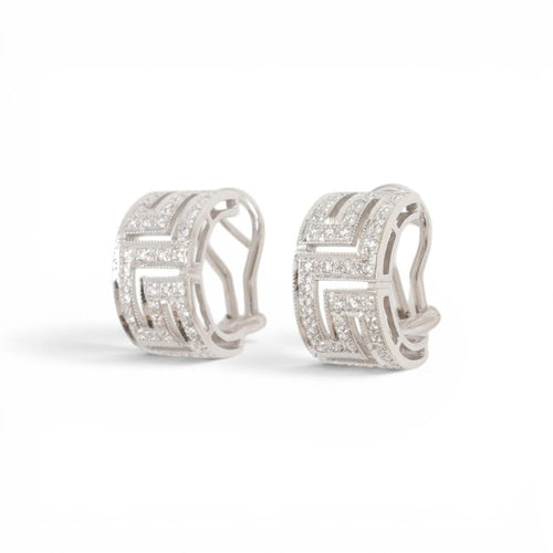 54 Parure bague et boucles d'oreilles en or 18 carats et diamants 58 Facettes E61