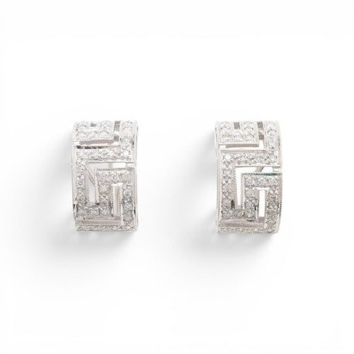 54 Parure bague et boucles d'oreilles en or 18 carats et diamants 58 Facettes E61