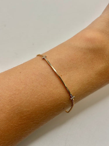 Bracelet Tiffany & Co T - Bracelet en or jaune 18K et diamants 58 Facettes 2134
