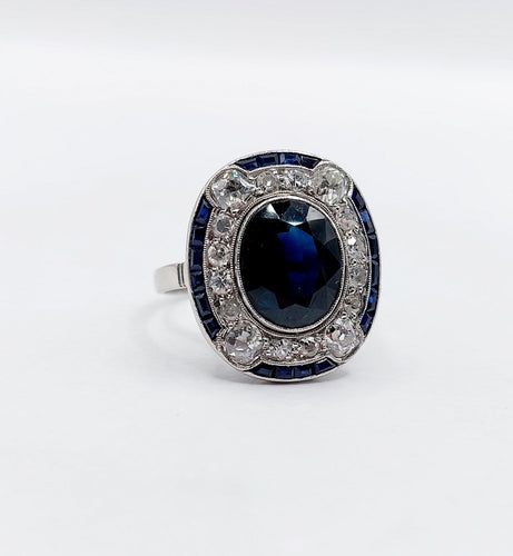 50 Bague pompadour Art déco en or blanc, saphir et diamants 58 Facettes A07580