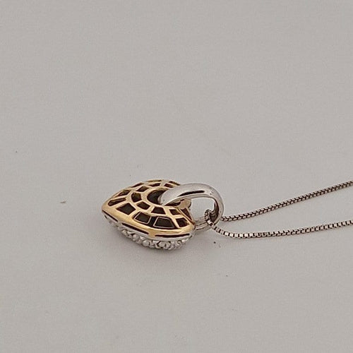 Collier cœur en or jaune et blanc avec brillants 58 Facettes 2909737