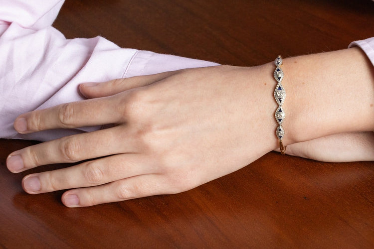 Bracelet géométrique en or jaune et blanc, diamants et saphirs 58 Facettes 13414