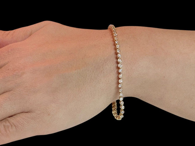 Bracelet tennis en or jaune 18 carats et diamants 58 Facettes BR1572