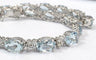 Bracelet tennis en or blanc 18 ct avec aigue-marine et diamants 58 Facettes 451/26 D