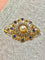 Broche en or jaune avec saphirs, diamants et perle 58 Facettes AB736