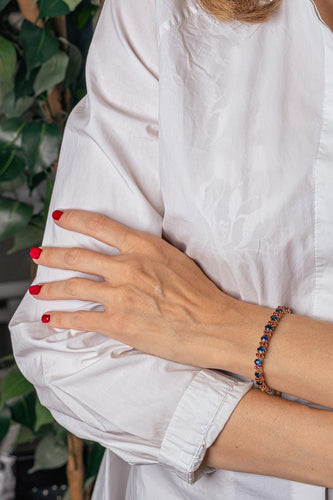 Bracelet en or rose et jaune avec saphirs et rubis 58 Facettes 4776474CN