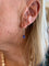 Boucles d'oreilles dormeuses en or gris 18 carats et tanzanites poire 58 Facettes
