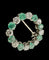 Broche cercle en or blanc, diamants et émeraudes naturelles 58 Facettes broche 1