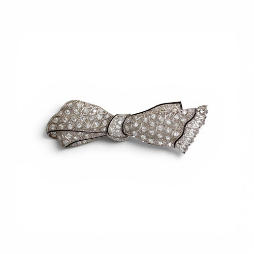 Broche nœud en platine, diamants et onyx 58 Facettes