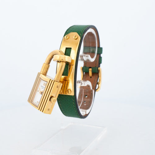 Hermès Kelly - Montre en acier plaqué or, cadran ivoire 58 Facettes 563
