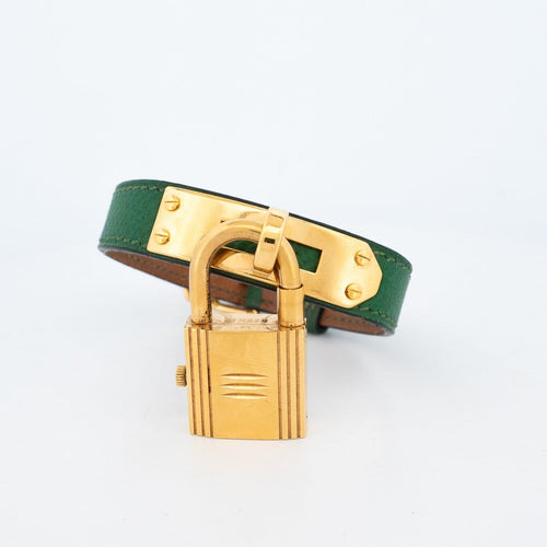 Hermès Kelly - Montre en acier plaqué or, cadran ivoire 58 Facettes 563