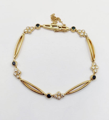 Bracelet vintage en or 18k, diamants et saphirs 58 Facettes A07641