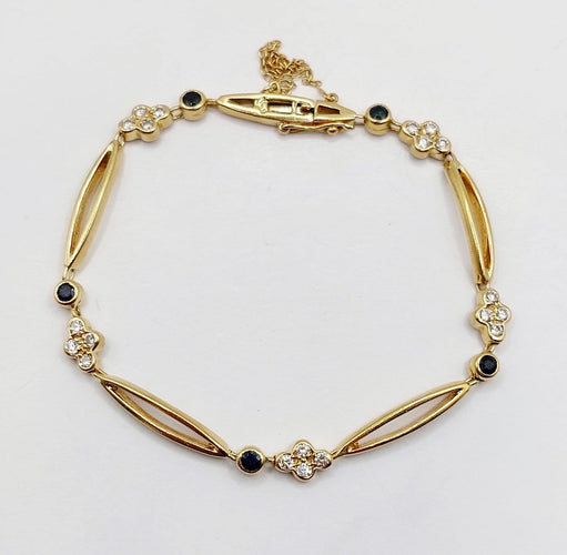 Bracelet vintage en or 18k, diamants et saphirs 58 Facettes A07641