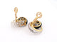 Boucheron - Boucles d'oreilles en or jaune, onyx, cristal de roche et diamants 58 Facettes 275837