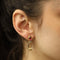 Boucles d’oreilles clips en or jaune 18k, tourmalines, diamants et cristal 58 Facettes FB11631