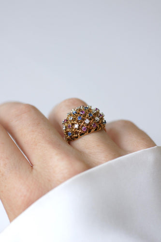 57 Bague boule cordage en or rose, saphirs, rubis et diamants 58 Facettes