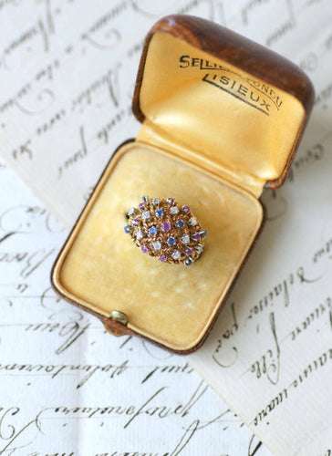 57 Bague boule cordage en or rose, saphirs, rubis et diamants 58 Facettes