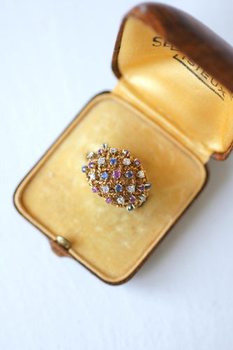 57 Bague boule cordage en or rose, saphirs, rubis et diamants 58 Facettes