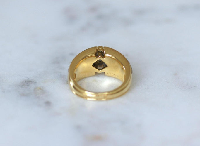53 Boucheron - Bague en or jaune, diamants et cristal de roche 58 Facettes