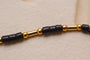 https://cdn.shopify.com/s/files/1/0963/7950/2920/files/Bracelet-lezard-et-perles-de-rocailles-bracelet-de-seconde-main_8c6df43d-6584-4cbb-bff7-0f588d82e12c.jpg?v=1779981144