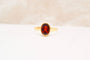 51 Bague solitaire ovale en or jaune et grenat 58 Facettes 4078