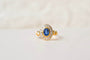 50 Bague marguerite ovale en or jaune, saphir et diamants 58 Facettes 4173