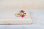 53 Bague fleuron en deux ors, demi-perle, rubis et diamants 58 Facettes 3735