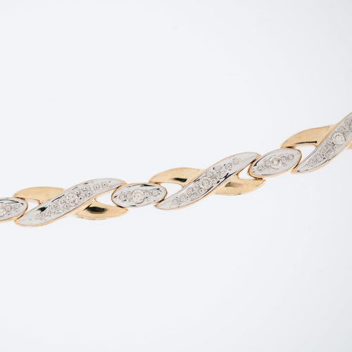 Bracelet français vintage en or jaune et blanc 18 carats avec diamants 58 Facettes BR1510