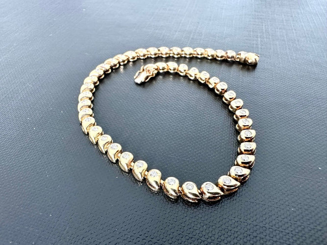 Bracelet tennis en or jaune 18 carats avec diamants 58 Facettes BR1513