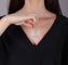 Pendentif ovale en or gris et diamants 58 Facettes 259184