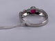 51 Bague ovale torsadée en or blanc, rubis et diamant 58 Facettes BA 789