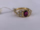 52 Bague serti clos en or jaune avec rubis ovale et diamants 58 Facettes BA 4