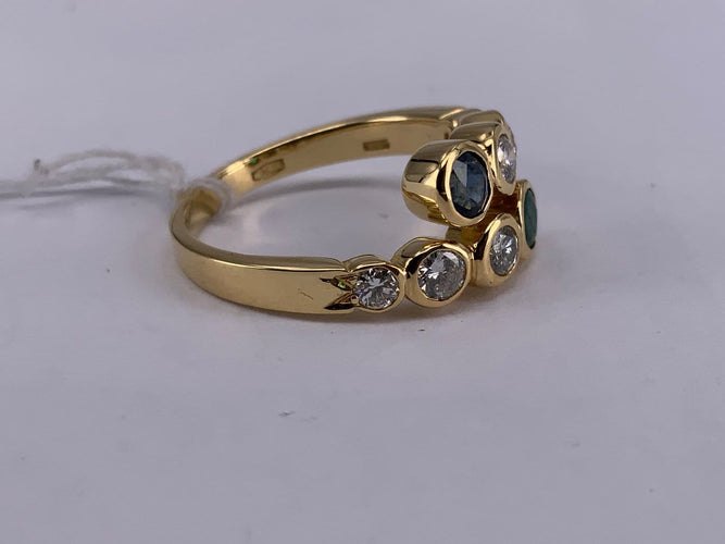 54 Bague Toi et Moi en or jaune, émeraude, saphir et diamant 58 Facettes BA 70
