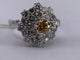 54 Bague cocktail en or blanc et diamants jaunes 58 Facettes BA 33