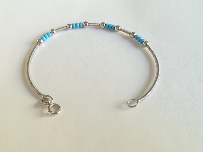 Bracelet en or blanc et turquoises 58 Facettes 01089
