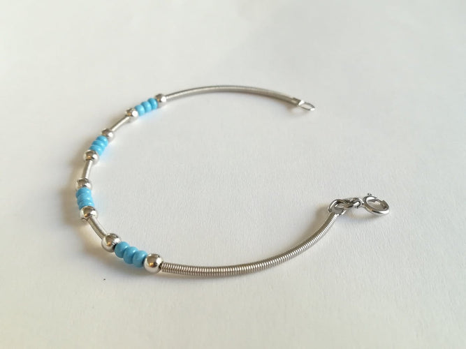 Bracelet en or blanc et turquoises 58 Facettes 01089